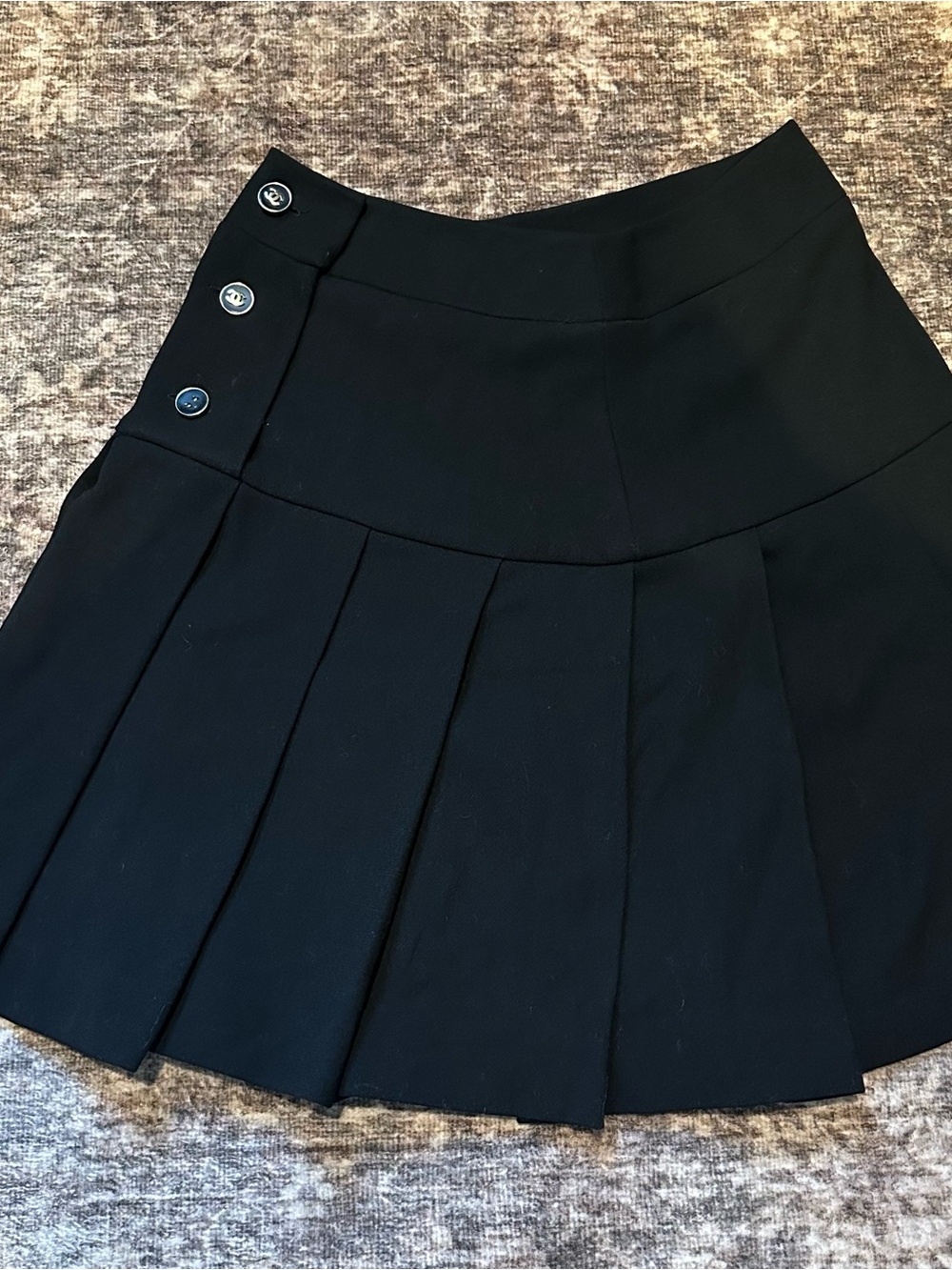 CHANEL Black Pleated Mini Skirt with Side Button Detail